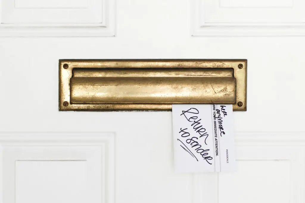 an envelope stuck in a mail slot with return to sender written on it 187591438 57cdceed3df78c71b65ce509