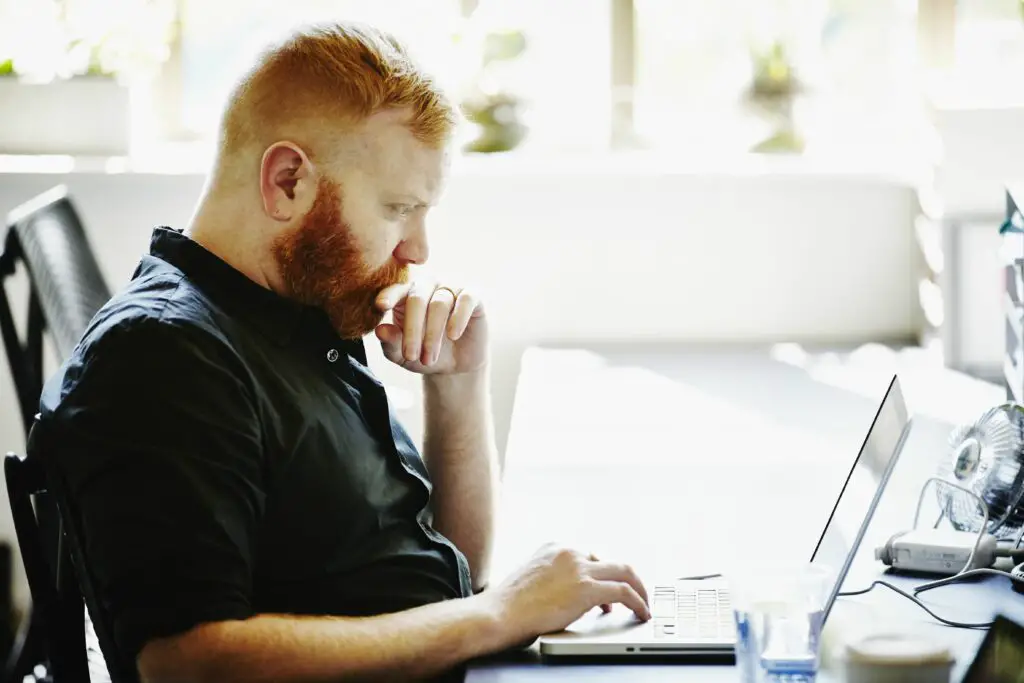 businessman at workstation in startup office 522517421 57e44f095f9b586c35b84c91