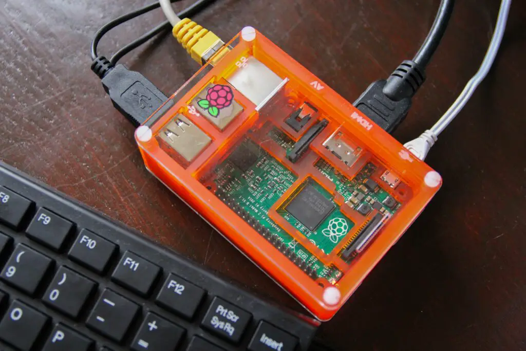 raspberry pi in an orange clear case 517985140 5b3640c3c9e77c0037e9a77a