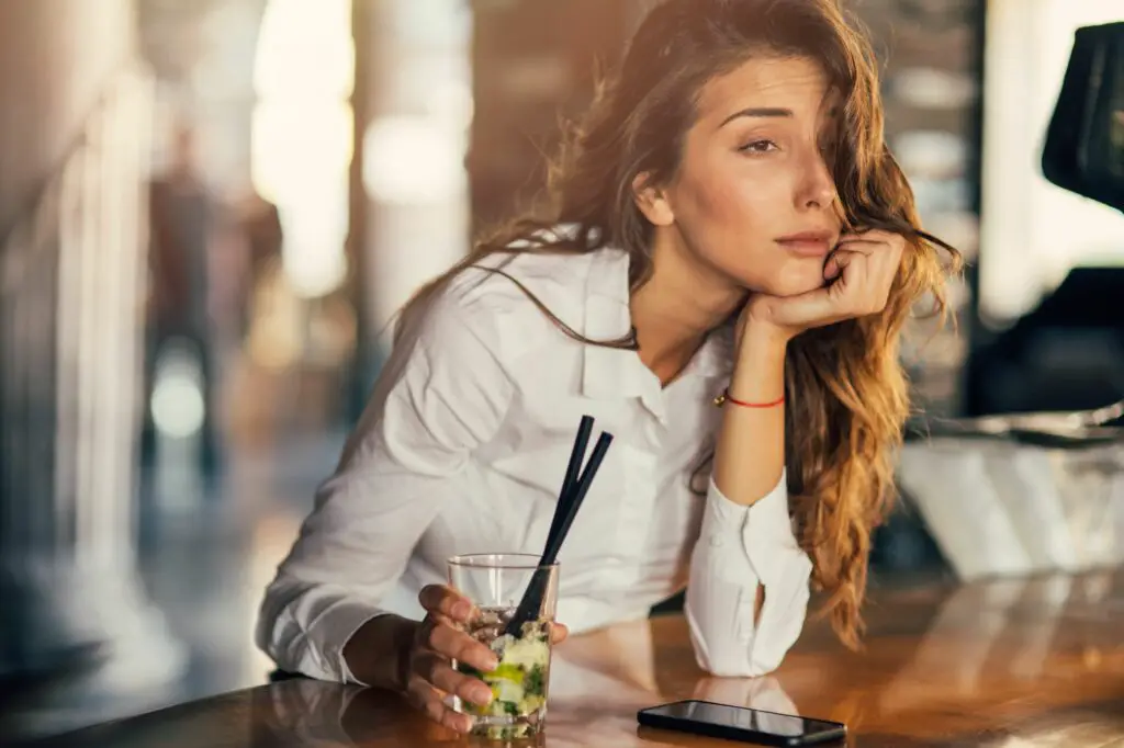 woman drinking cocktail in a bar 691762652 5a3732135b6e240037fb20f1