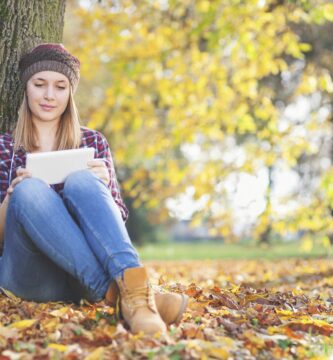 young girl in the park using her tablet pc 523033389 5be06900c9e77c00269007a5