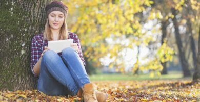 young girl in the park using her tablet pc 523033389 5be06900c9e77c00269007a5