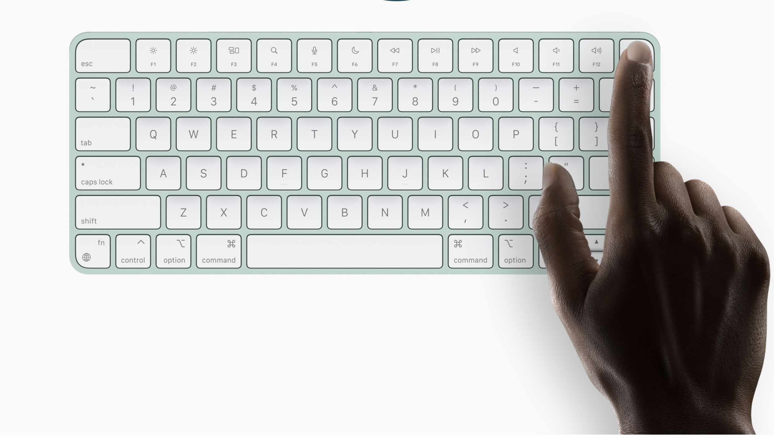 Hand met een eerder iMac-toetsenbordmodel