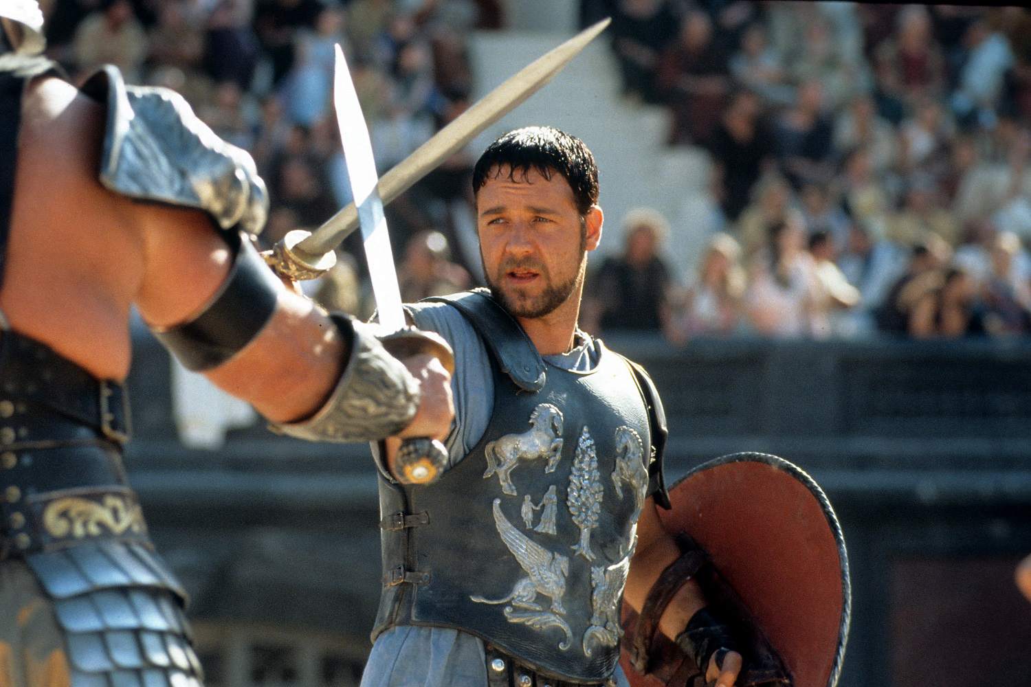 Een foto van een scène uit de film Gladiator, met de hoofdpersoon Maximus gespeeld door Russell Crowe.