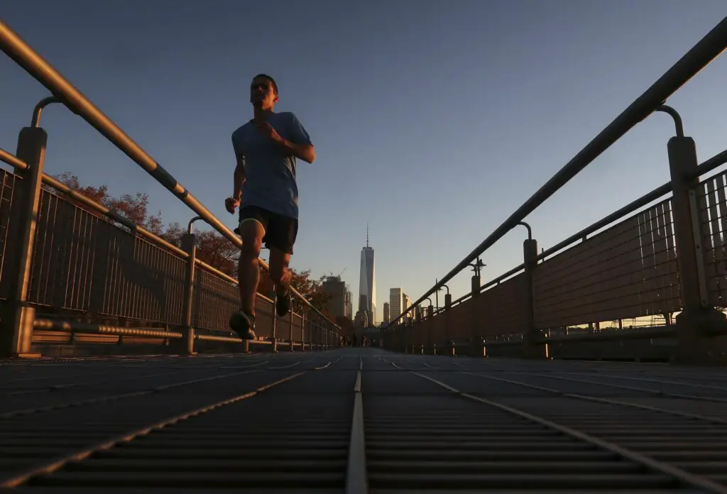 a man runs in the hudson river park at sunset in new york city 624813952 583659073df78c6f6a5efd57