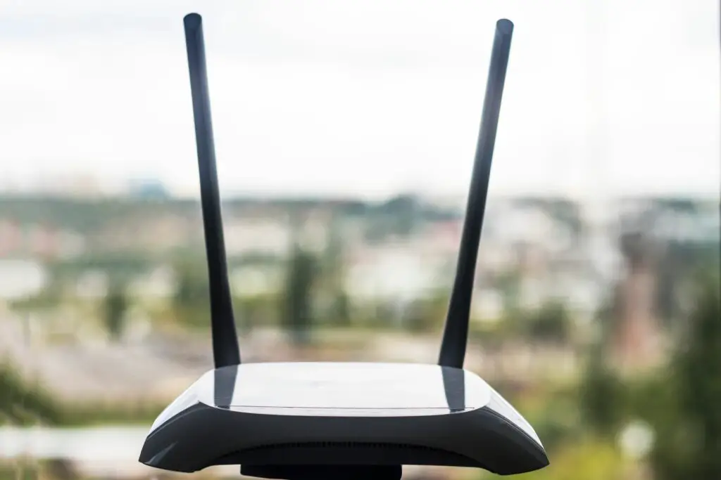 close up of wireless router by window 1025071730 5c4bac4346e0fb0001a8e6e6