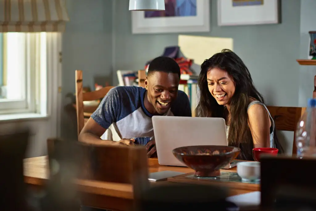 couple laughing at footage on laptop at breakfast 652553835 5a3a81104e46ba00361b8d2e 0e183f3ad8a9414e9f0586b5fe20bb26