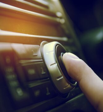 cropped image of human finger touching music system in car 688982955 5a283718da271500372ab09a