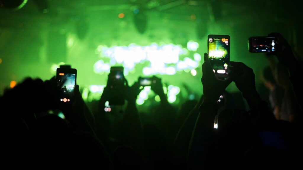 group of people using smart phone at music concert 763276353 a33d46d1b7c74a7c9d469879a87f9a27