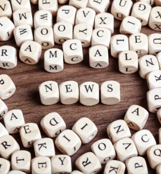 high angle view of news text arranged with alphabet blocks on wooden table 746119745 5bdf213bc9e77c0051ac3ce2