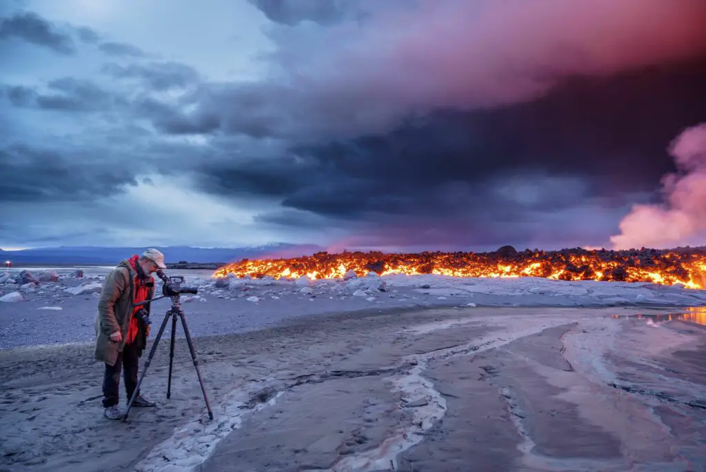 photographer filming the volcano eruption at the holuhraun fissure near the bardarbunga volcano ic 521905722 57b3b5325f9b58b5c205f945