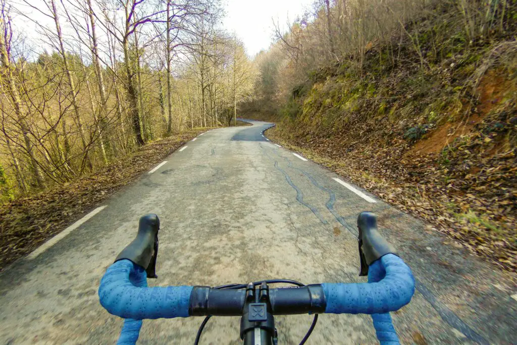 solo cyclist with blue handlebars in winter forest 653836842 5a2f08da89eacc0037a0e1c1 aa31864a593d4794b04d371f60f63e80