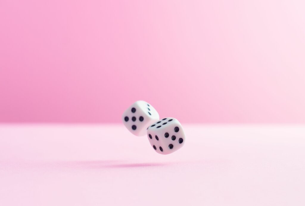 studio shot of two dice over pink background 724318579 5af48f64a474be003778933d