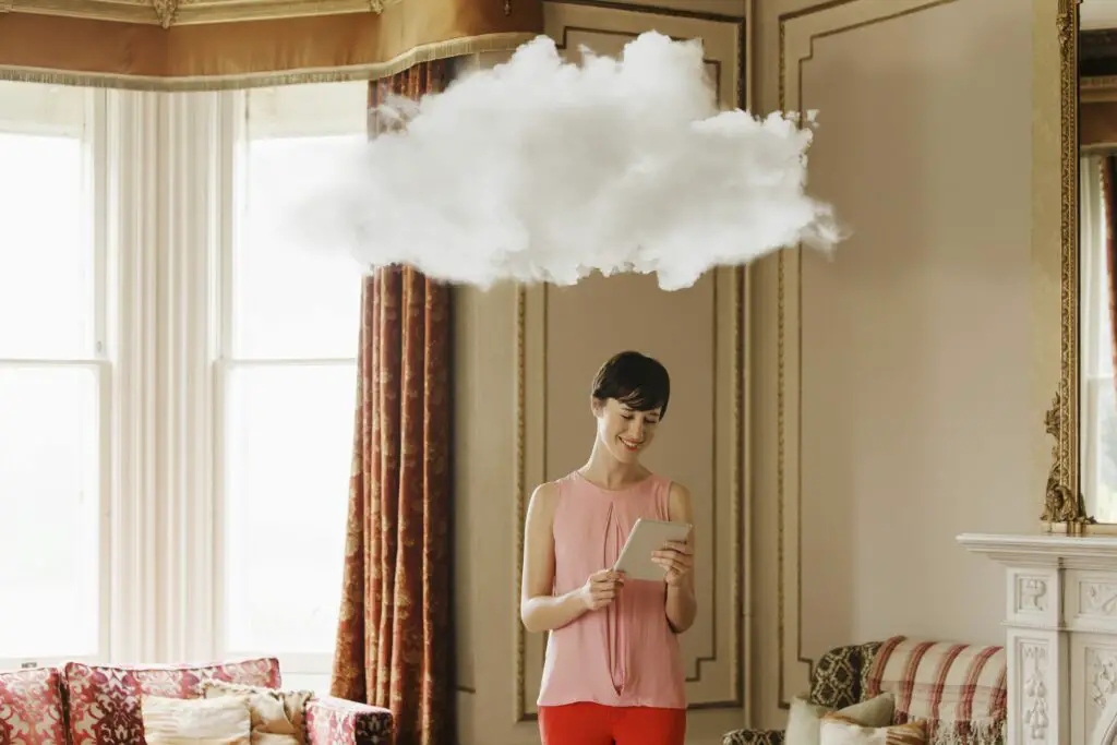 woman in living room with cloud above head 186666641 5b31276f0e23d900369687db