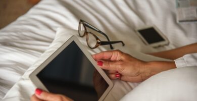 woman using digital tablet on bed 760250981 5b8460bec9e77c005744bba4