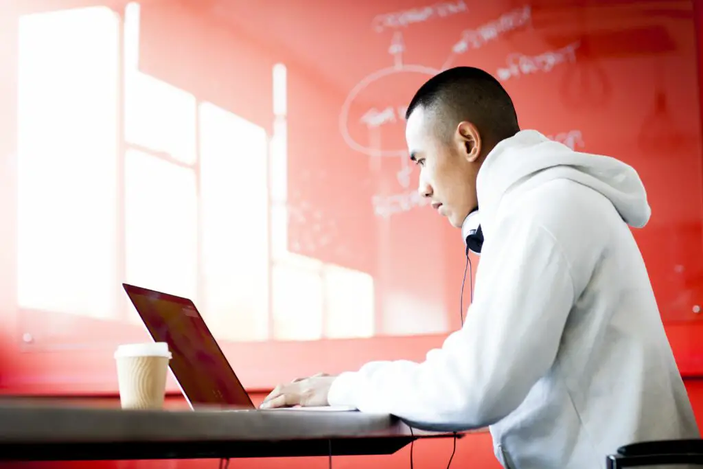 young asian man working on his laptop computer 602907143 57e9c19e5f9b586c3506bdbf