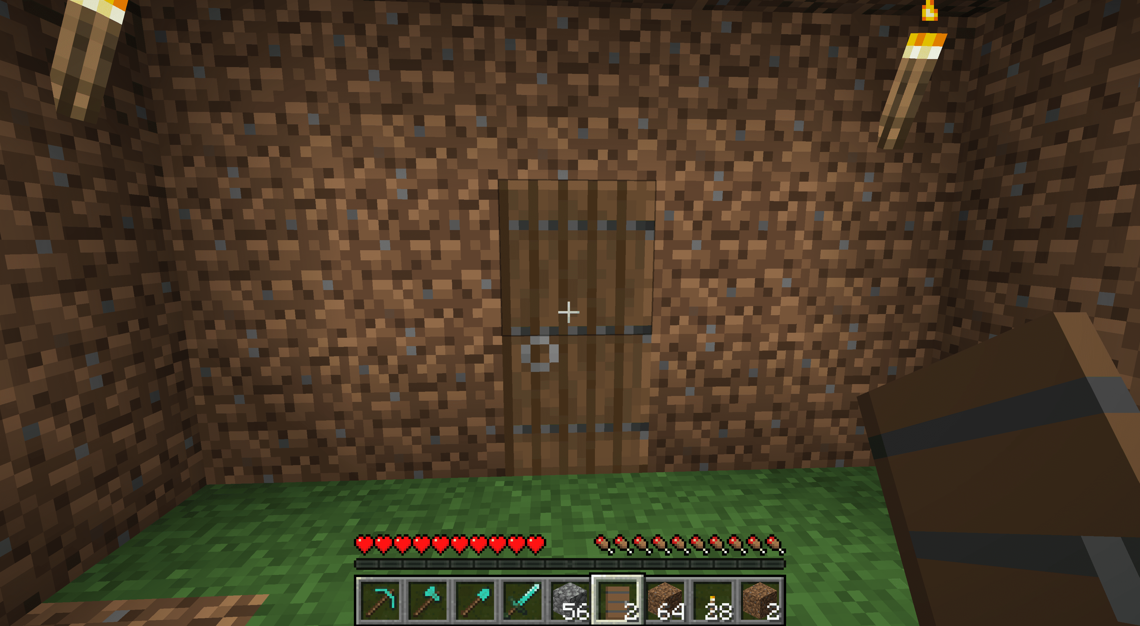 Een deur in een vuil Minecraft-huis.