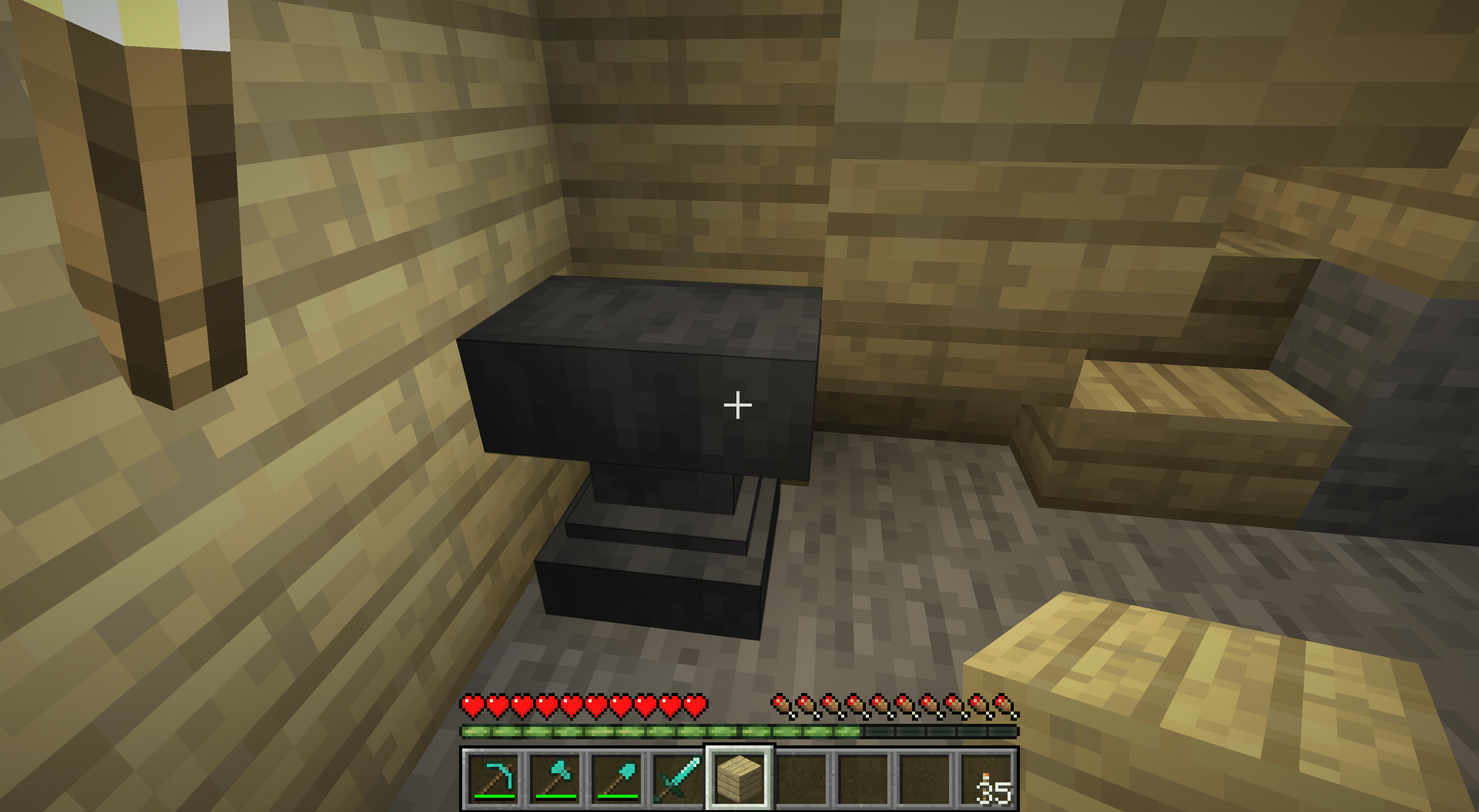 Een aambeeld in de kelder van een Minecraft-huis.