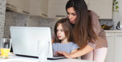 cute girl and mother using laptop at home 621830380 5b84905d4cedfd00258fa836