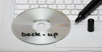 detail of a back up disc and a marker on a laptop 101883221 5bfae89946e0fb005188698c