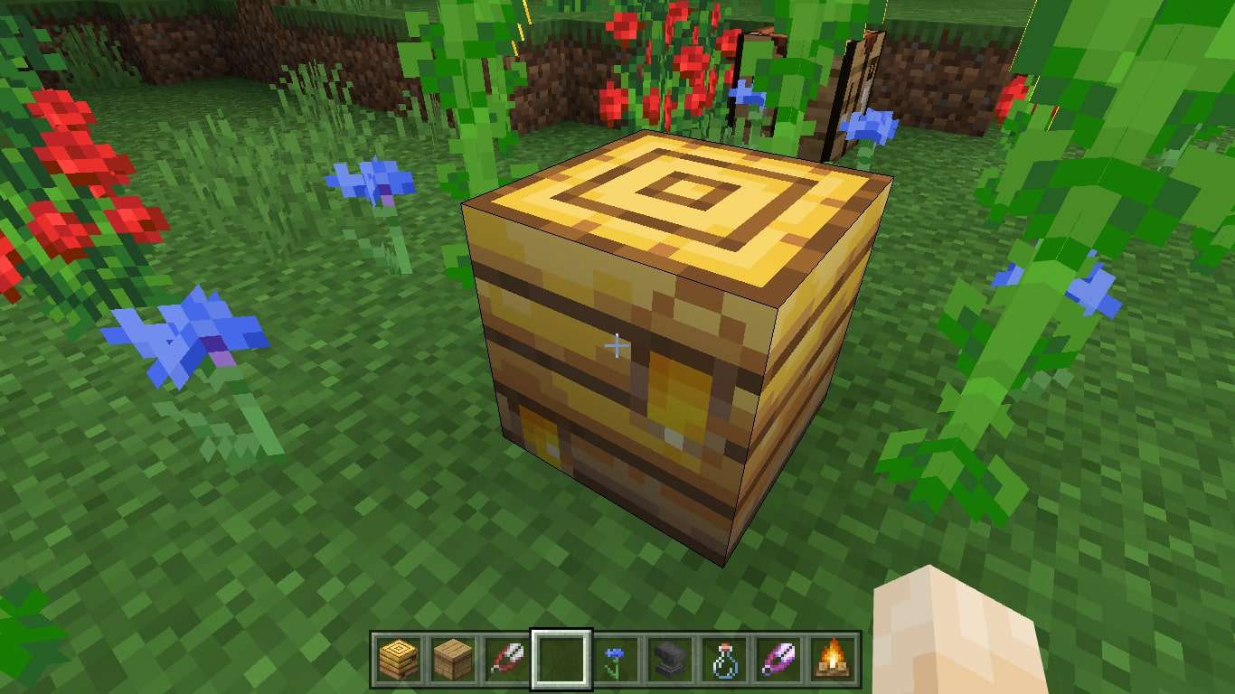 Gouden pixels honing op een bijenkorf in Minecraft